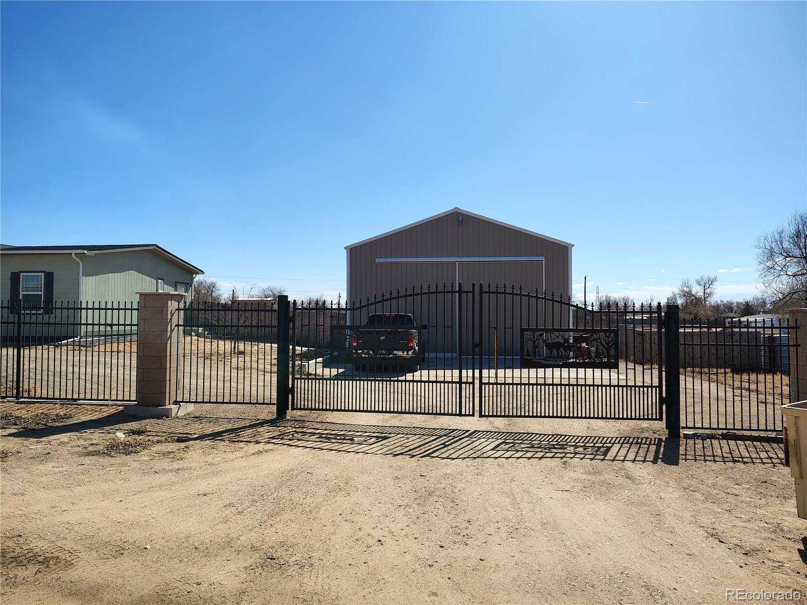 15460 Casler Avenue Fort Lupton, CO 80621 - Photo 4 of 13 a view of a house with a fence
