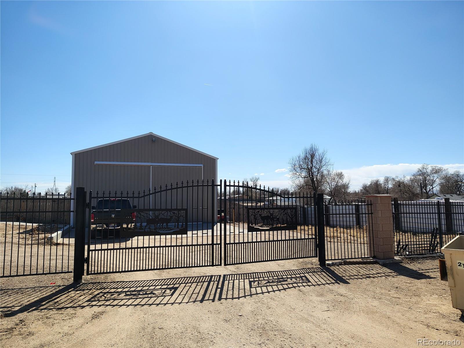 15460 Casler Avenue Fort Lupton, CO 80621 - Photo 5 of 13 a view of a wrought iron fences in front of house