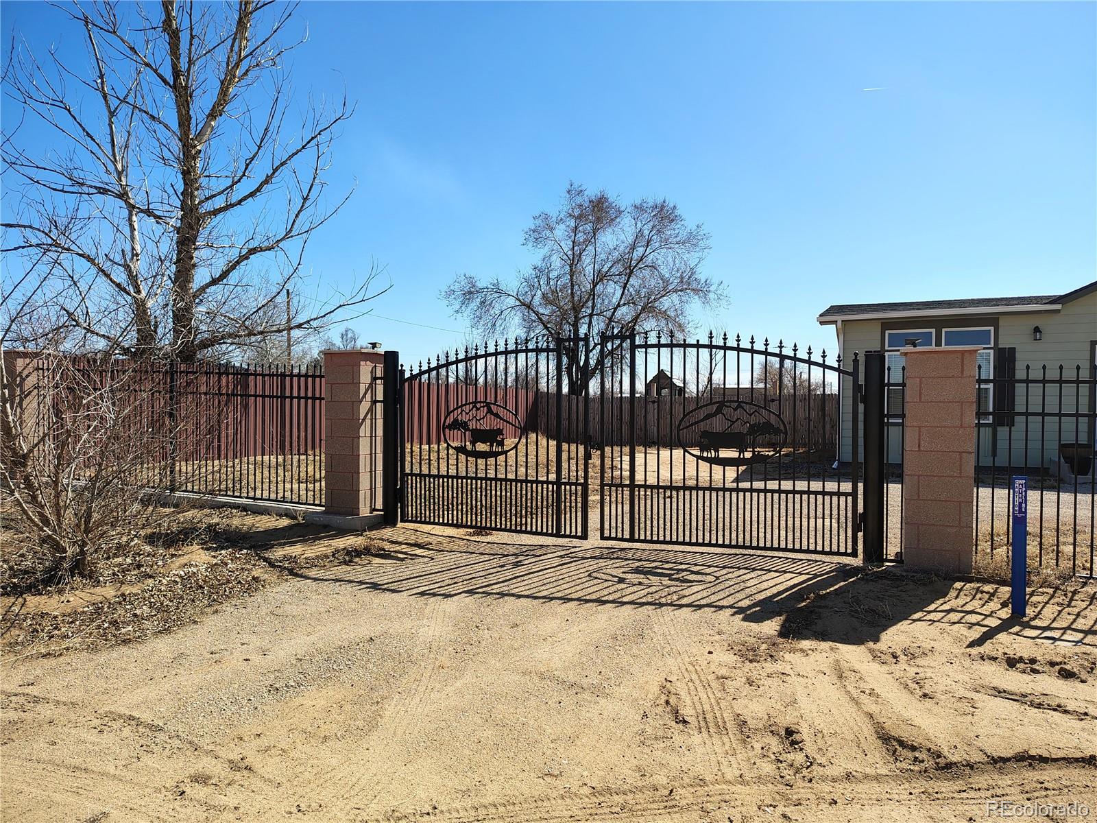 15460 Casler Avenue Fort Lupton, CO 80621 - Photo 8 of 13 a view of a backyard with a snow