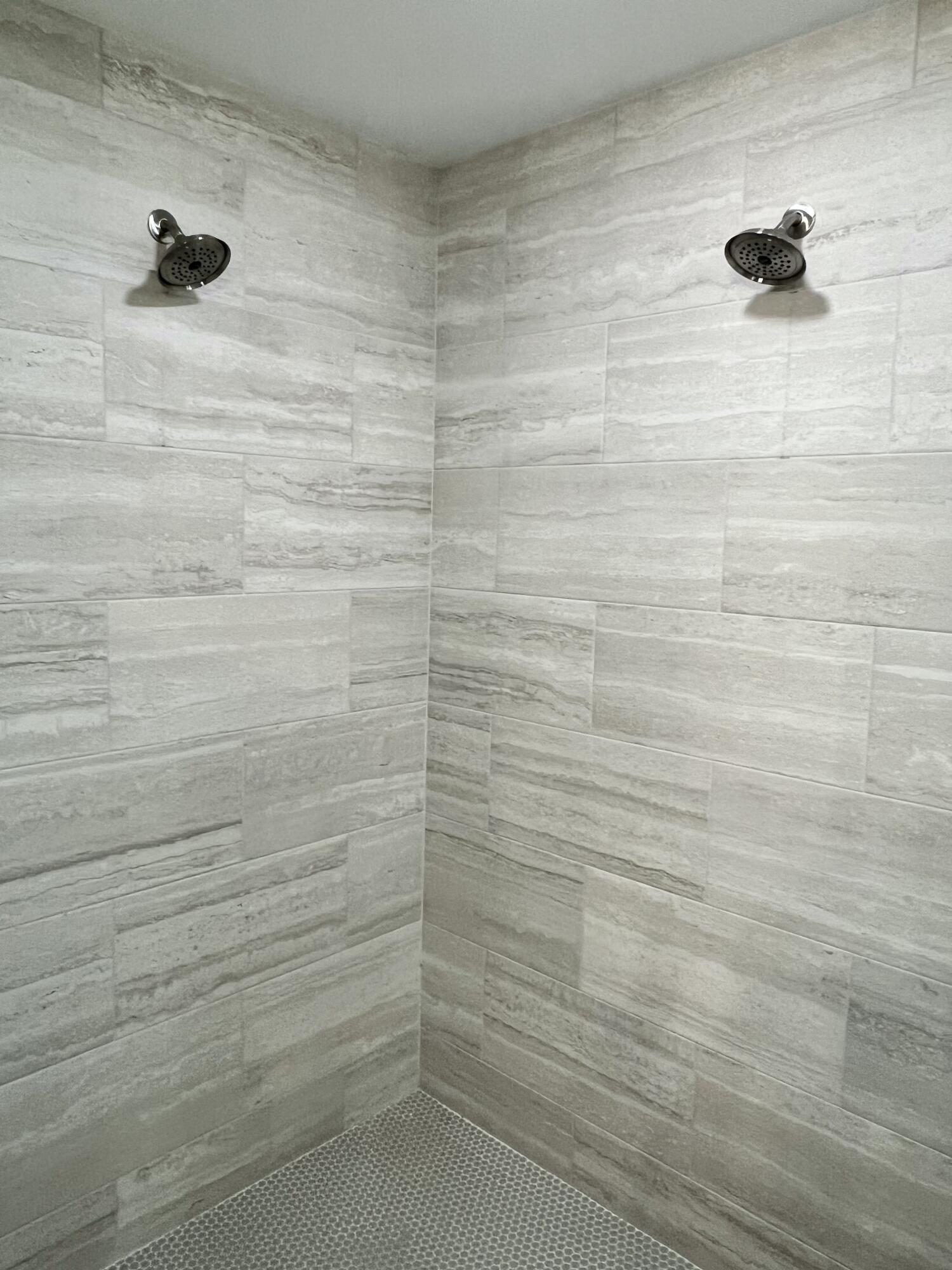 7586 Vinca Street Navarre, FL 32566 - Photo 18 of 44 a bathroom with a shower