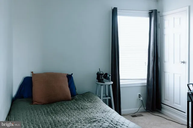 a room with a bed and a window