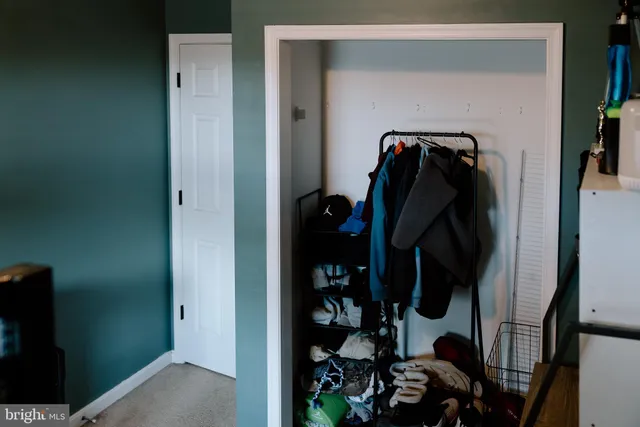 a view of room with cabinet and flat screen tv