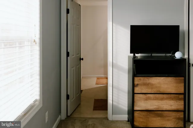 a bathroom with a sink vanity and a mirror