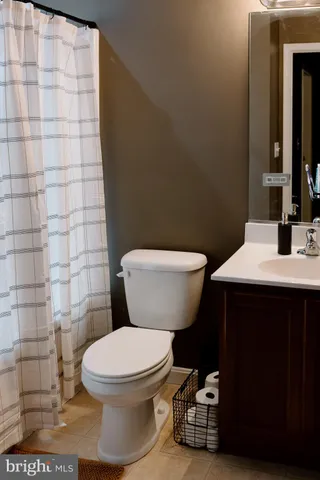 a bathroom with a toilet and shower