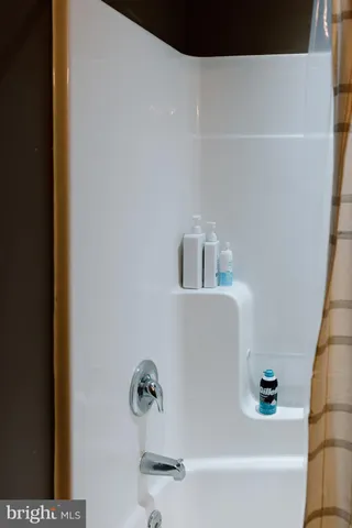 a kitchen with a sink and a refrigerator