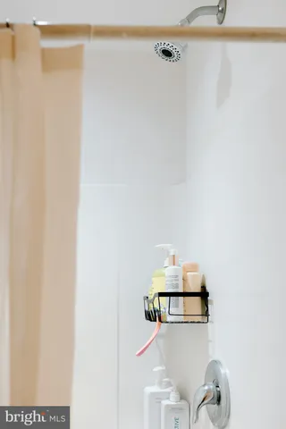 a front view of a house with basket ball court and outdoor seating