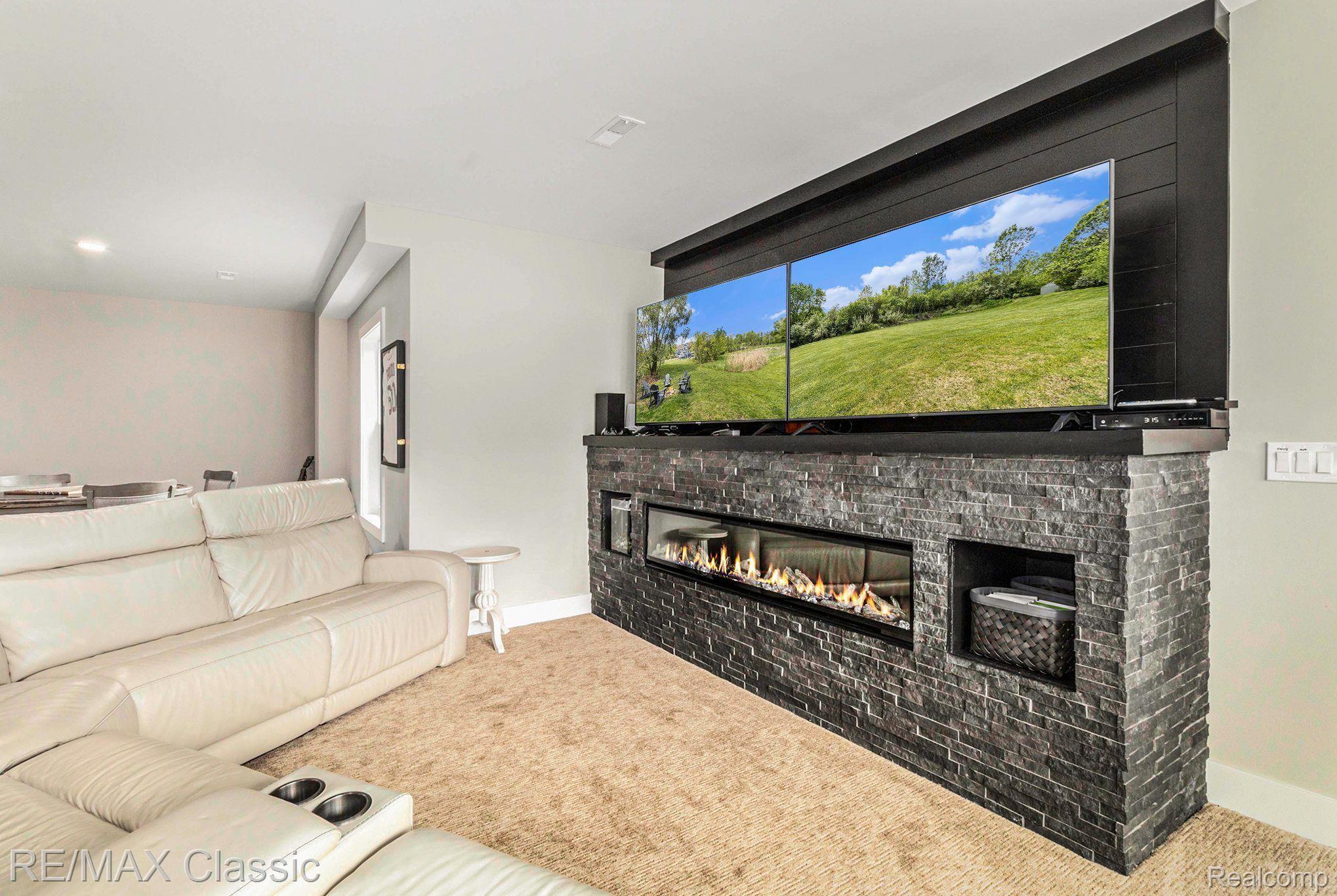 4553 Gregory Road Dexter, MI 48130 - Photo 46 of 62 Impressive Gas Fireplace & Two TV Hookups