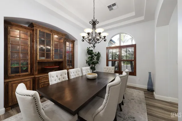 a bedroom with a bed window and a flat screen tv