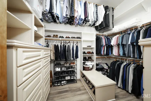 a en suite bathroom with a double vanity sink mirror and shower