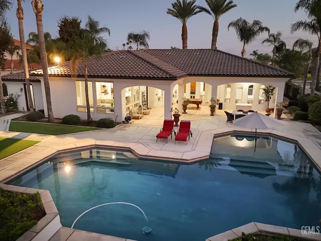 a view of a house with swimming pool
