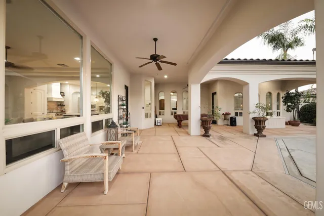 a bedroom with furniture and a flat screen tv
