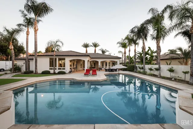 a view of a house with truck parked on the road