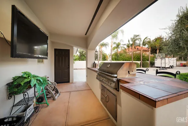 a front view of a house with a garden and yard