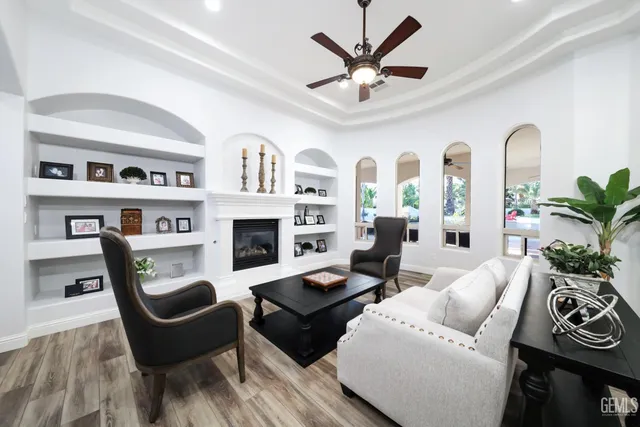 a living room with furniture fireplace and flat screen tv