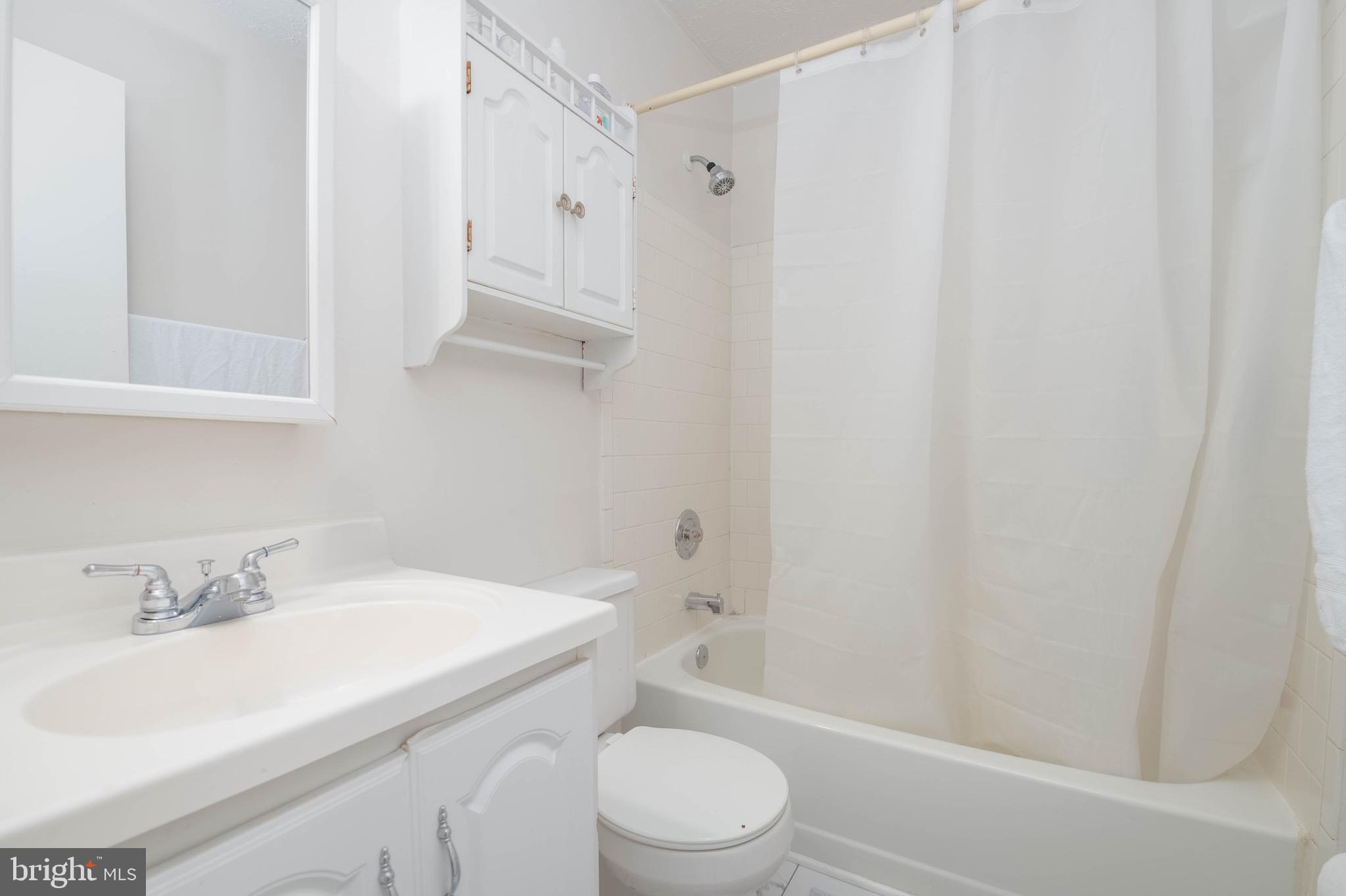 423 Kosoak Road Baltimore, MD 21220 - Photo 11 of 18 a bathroom with a sink toilet and shower