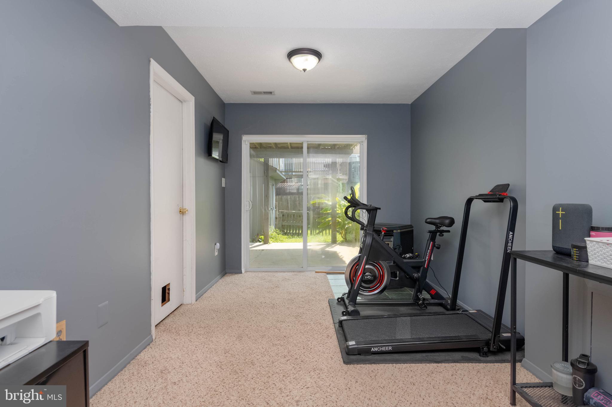 423 Kosoak Road Baltimore, MD 21220 - Photo 14 of 18 a room with gym equipment and a large window