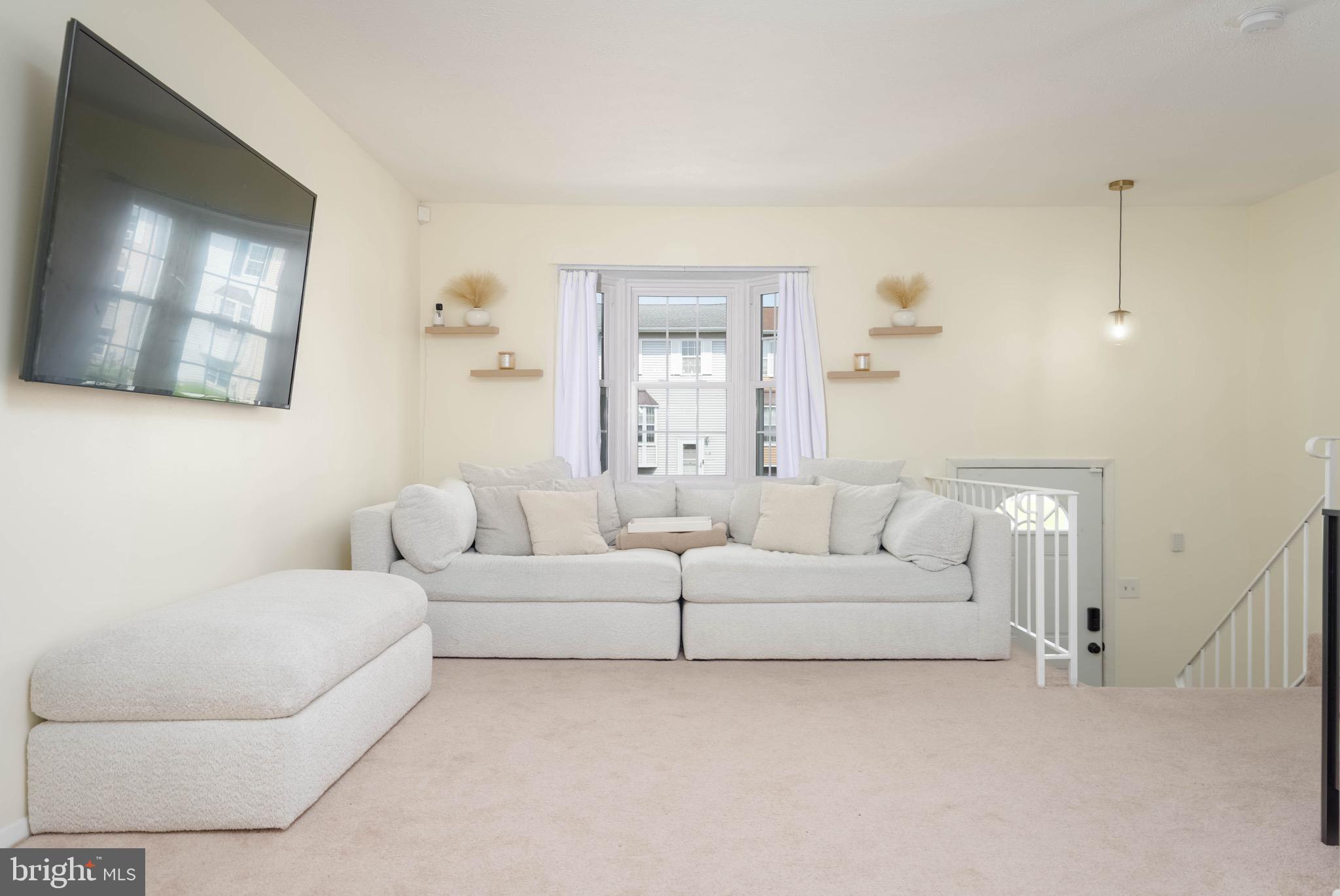 423 Kosoak Road Baltimore, MD 21220 - Photo 2 of 18 a living room with furniture and a large mirror
