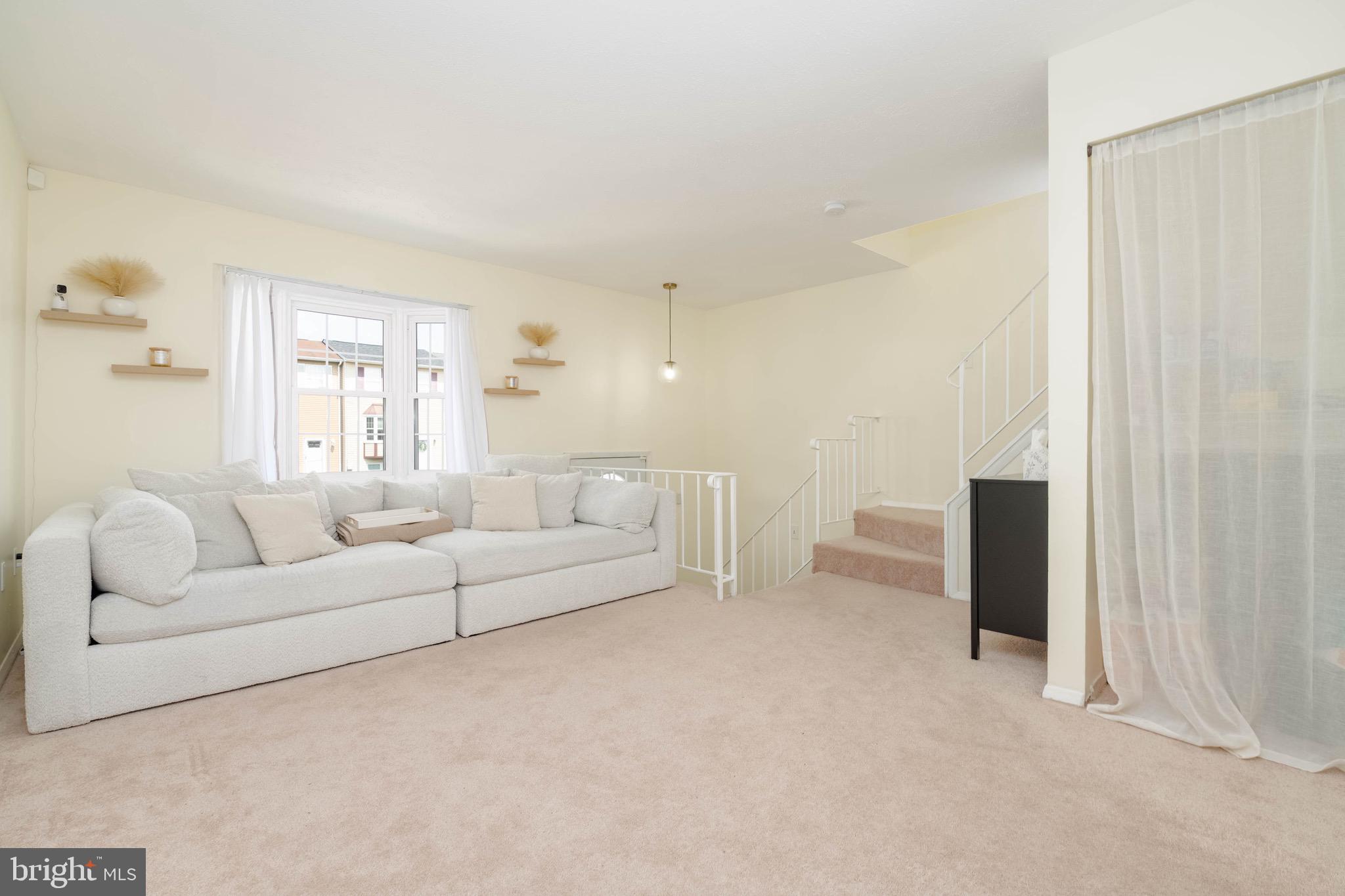423 Kosoak Road Baltimore, MD 21220 - Photo 3 of 18 a living room with furniture and a chandelier