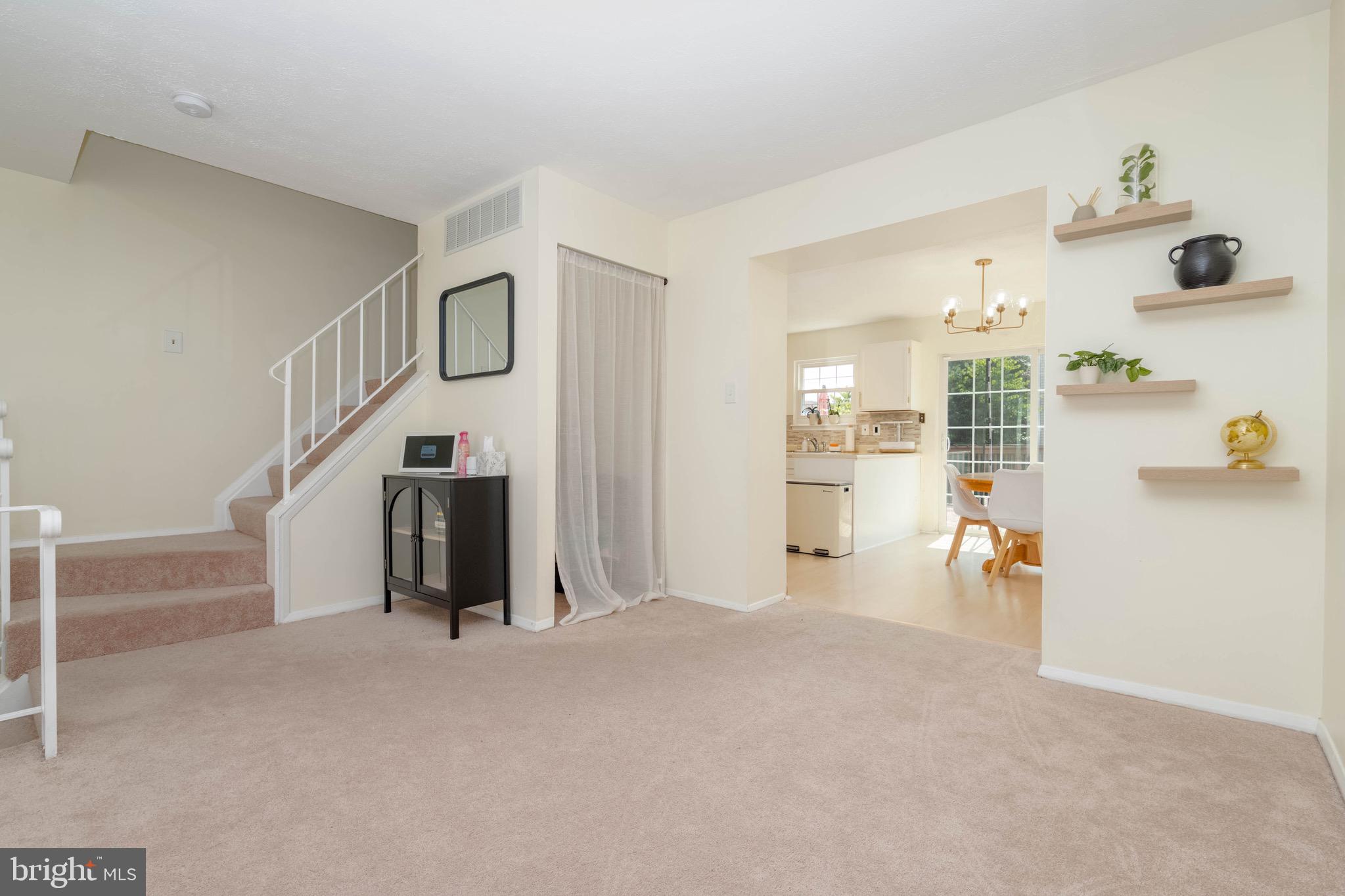 423 Kosoak Road Baltimore, MD 21220 - Photo 4 of 18 a view of empty room with wooden floor and windows