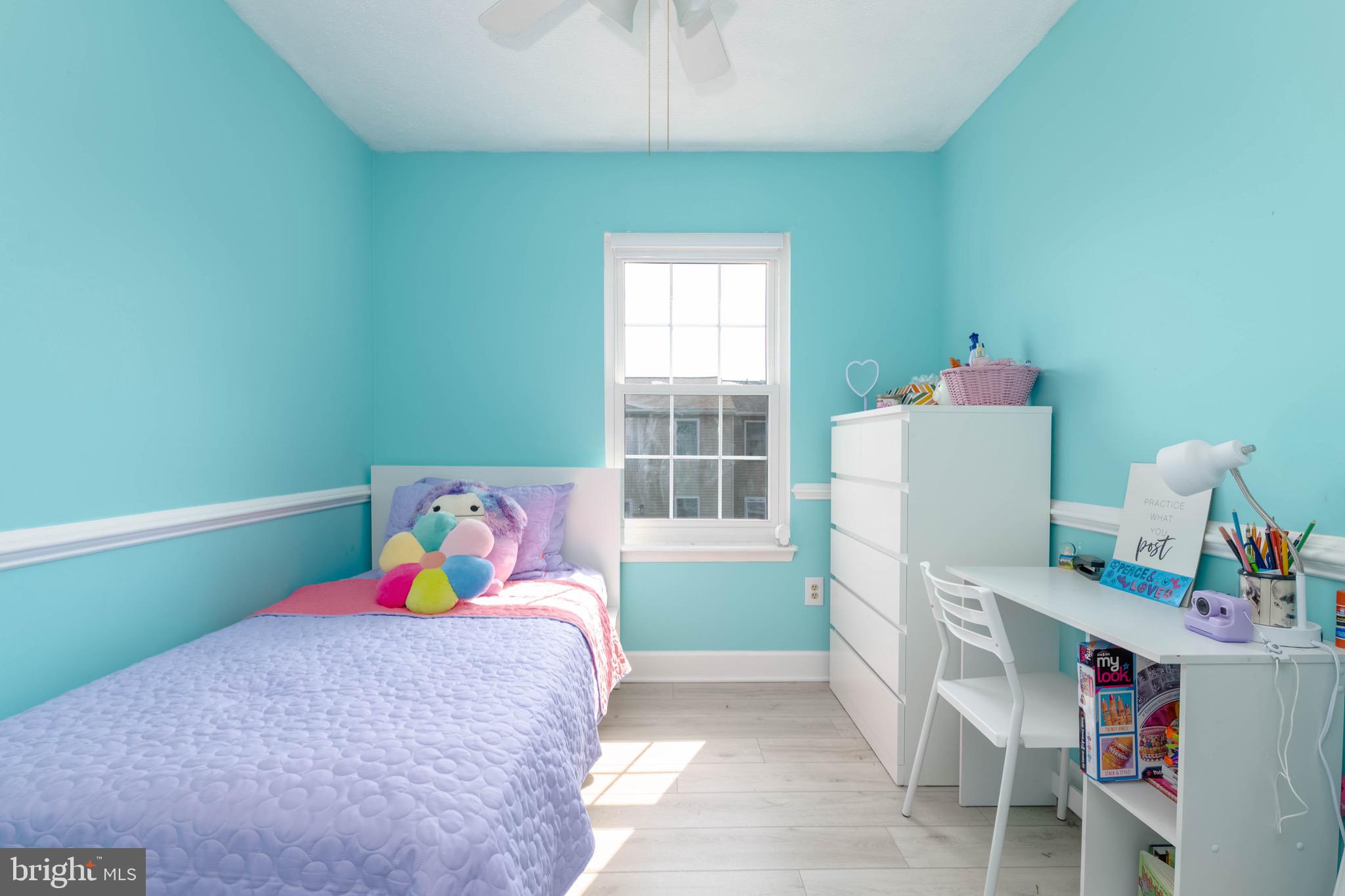 423 Kosoak Road Baltimore, MD 21220 - Photo 8 of 18 a bed room with a bed and a window