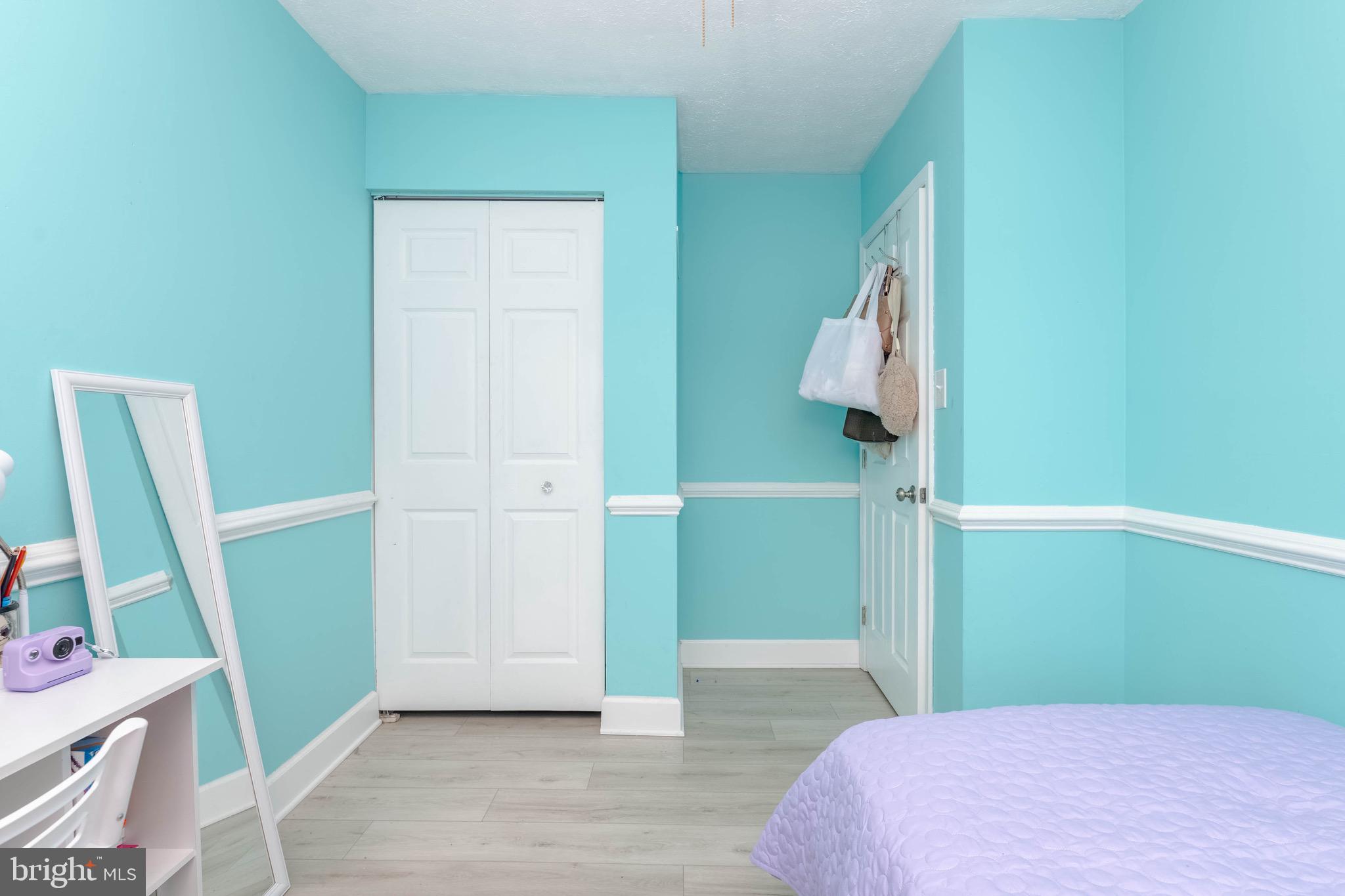 423 Kosoak Road Baltimore, MD 21220 - Photo 9 of 18 a bedroom with a bed and wooden floor