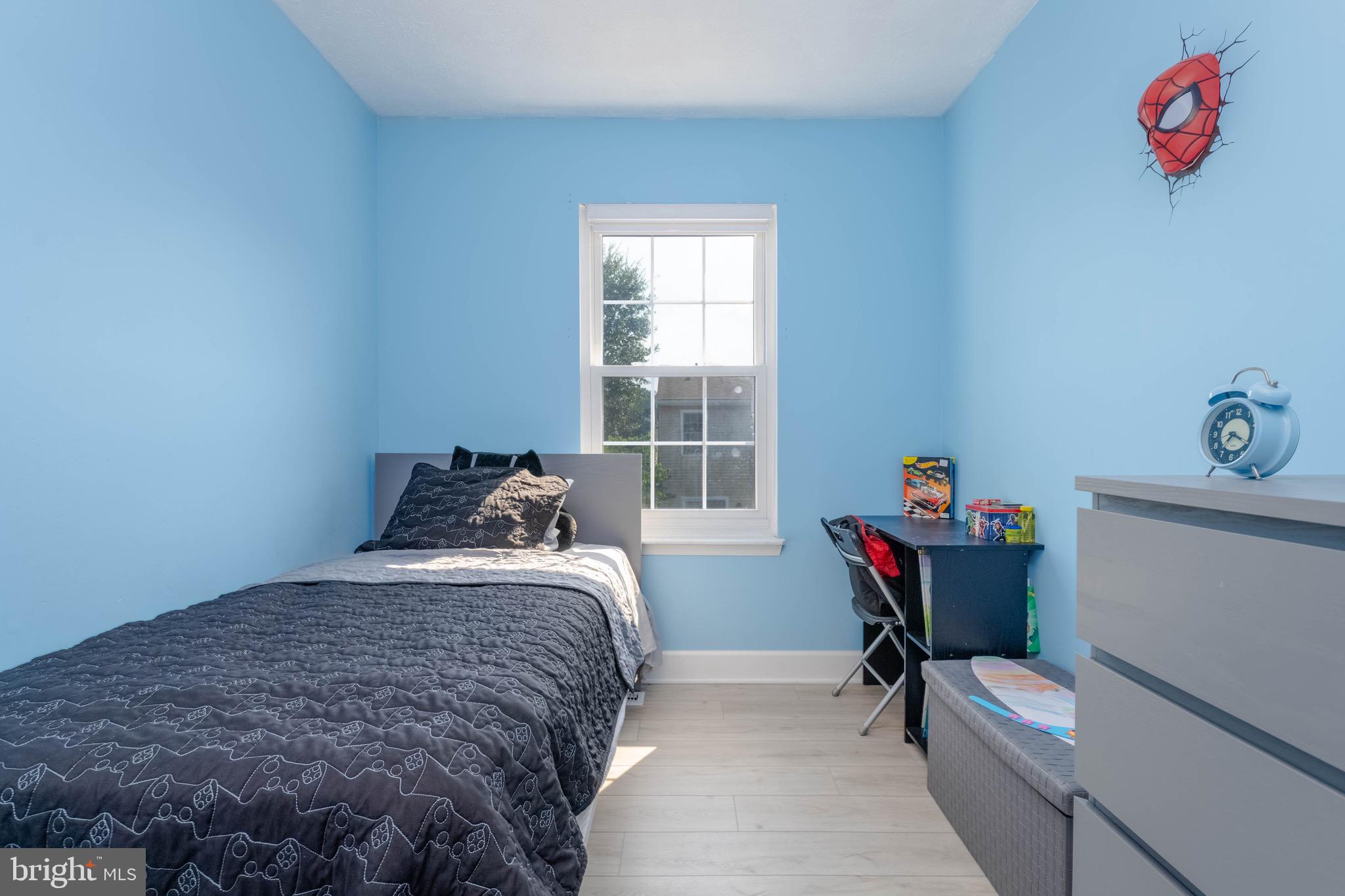 423 Kosoak Road Baltimore, MD 21220 - Photo 10 of 18 a bedroom with a bed and a chair