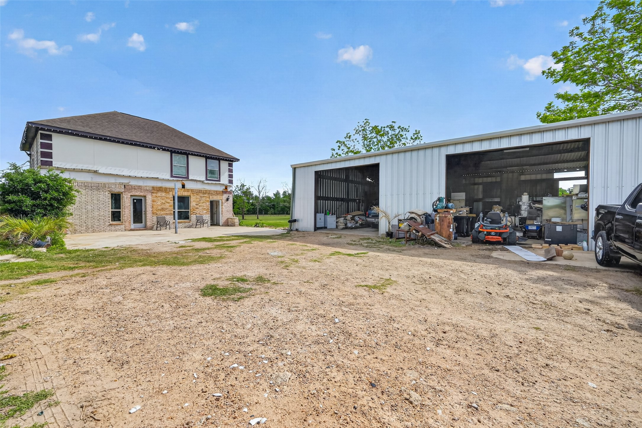 8023 Pool Hill Road Fulshear, TX 77441 - Photo 43 of 50 a front view of a house with a yard and garage