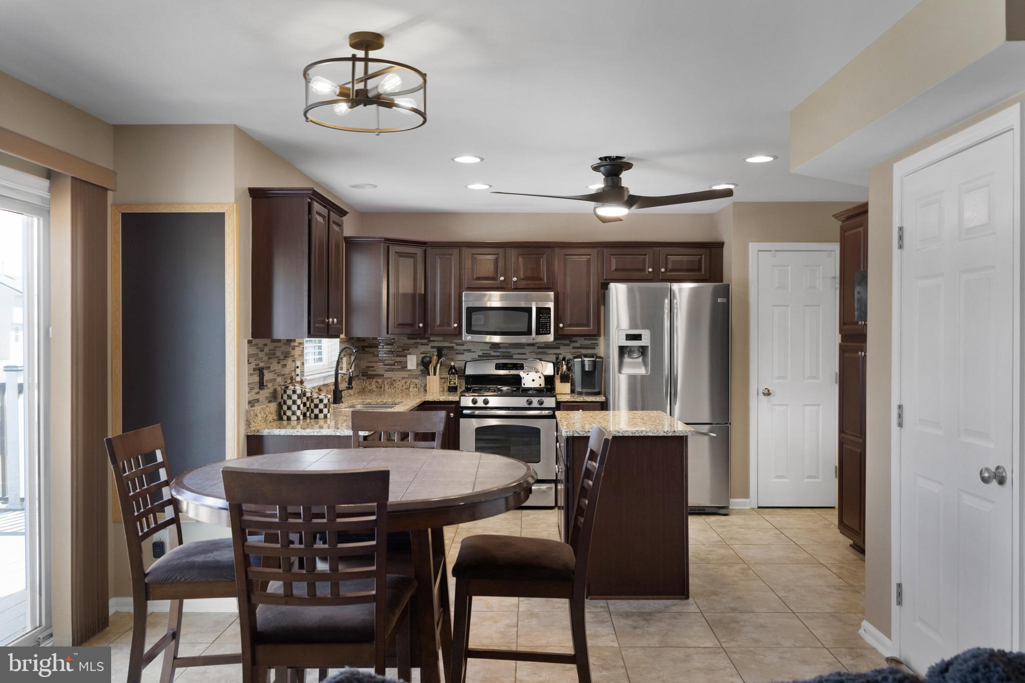 2 Tieman Circle Delanco, NJ 08075 - Photo 12 of 30 a view of kitchen with refrigerator stove dining table and chairs