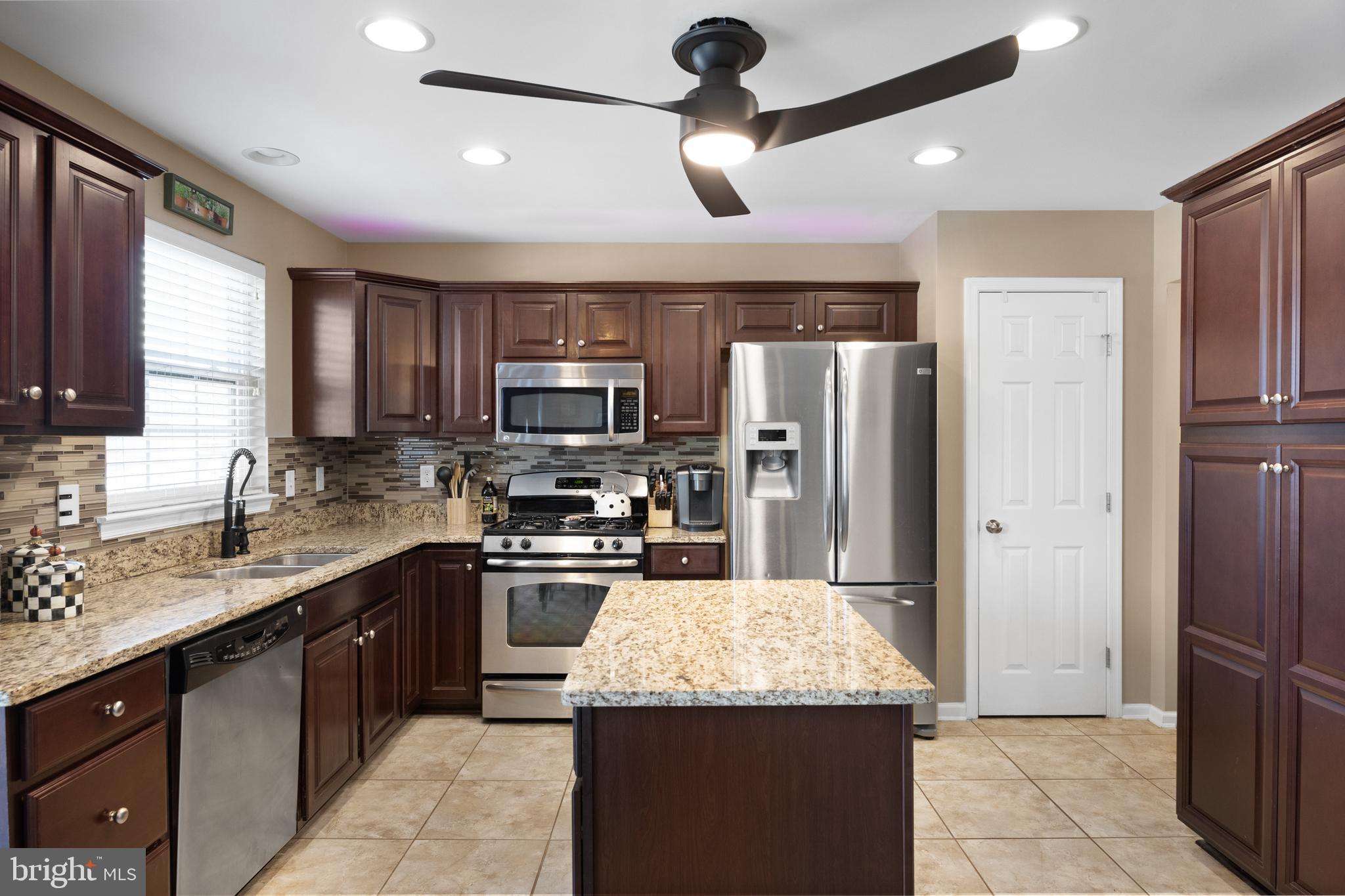 2 Tieman Circle Delanco, NJ 08075 - Photo 14 of 30 a kitchen with kitchen island granite countertop appliances cabinets and a sink