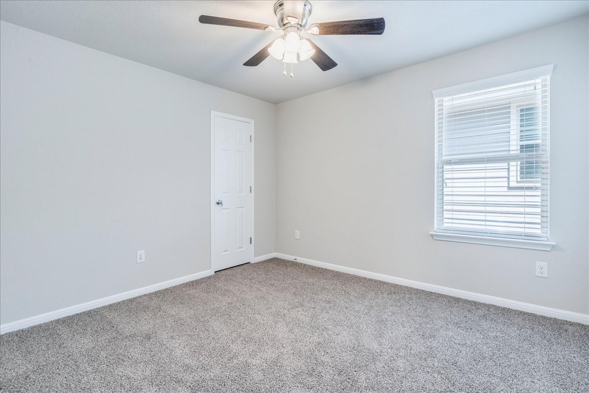 312 Triumph Road Buda, TX 78610 - Photo 28 of 36 a view of an empty room with a window