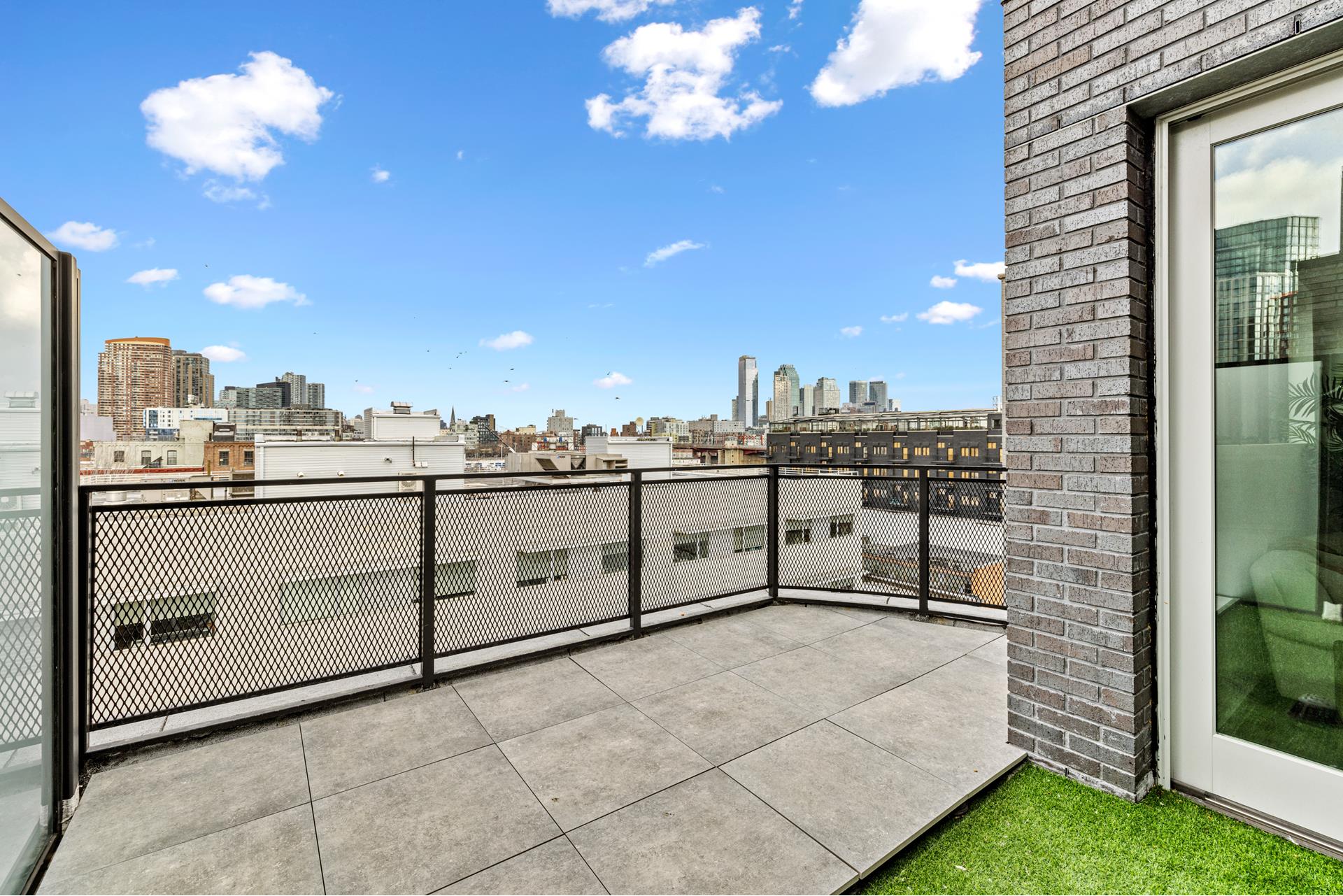 44 Box Street, Unit PHA Brooklyn, NY 11222 - Photo 15 of 18 a view of a terrace with a chair
