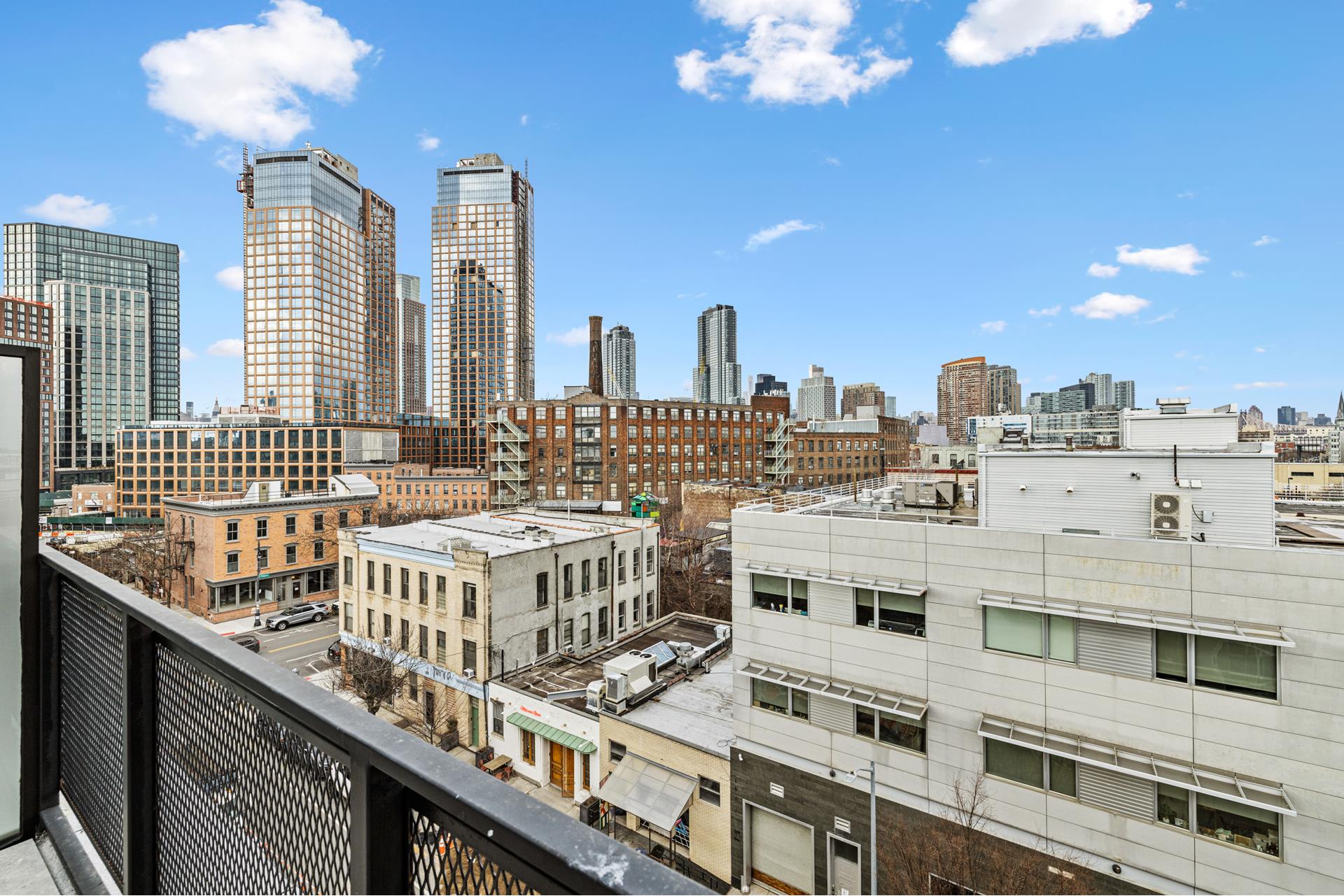 44 Box Street, Unit PHA Brooklyn, NY 11222 - Photo 16 of 18 a view of a balcony with chairs