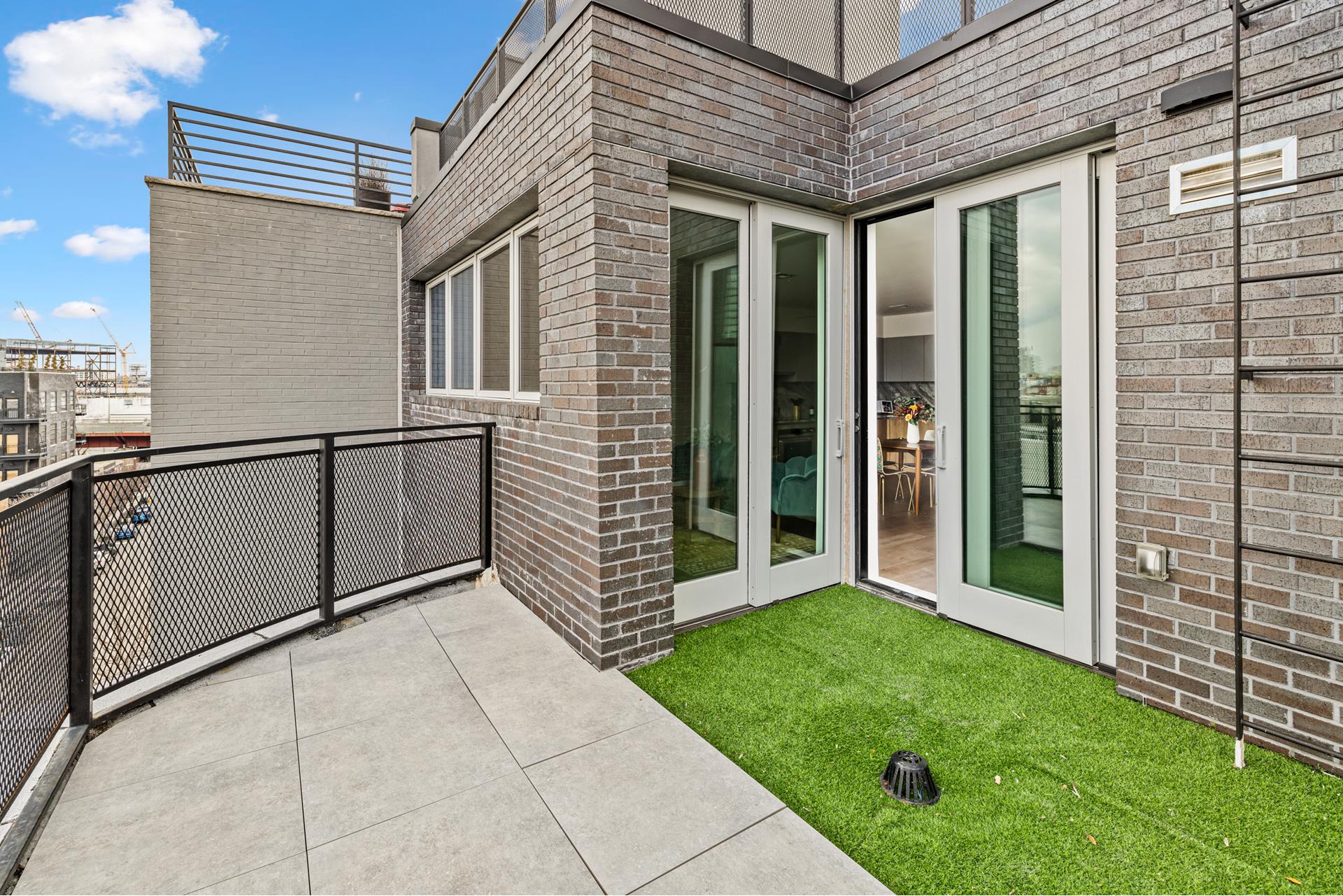 44 Box Street, Unit PHA Brooklyn, NY 11222 - Photo 17 of 18 a view of a porch with a backyard
