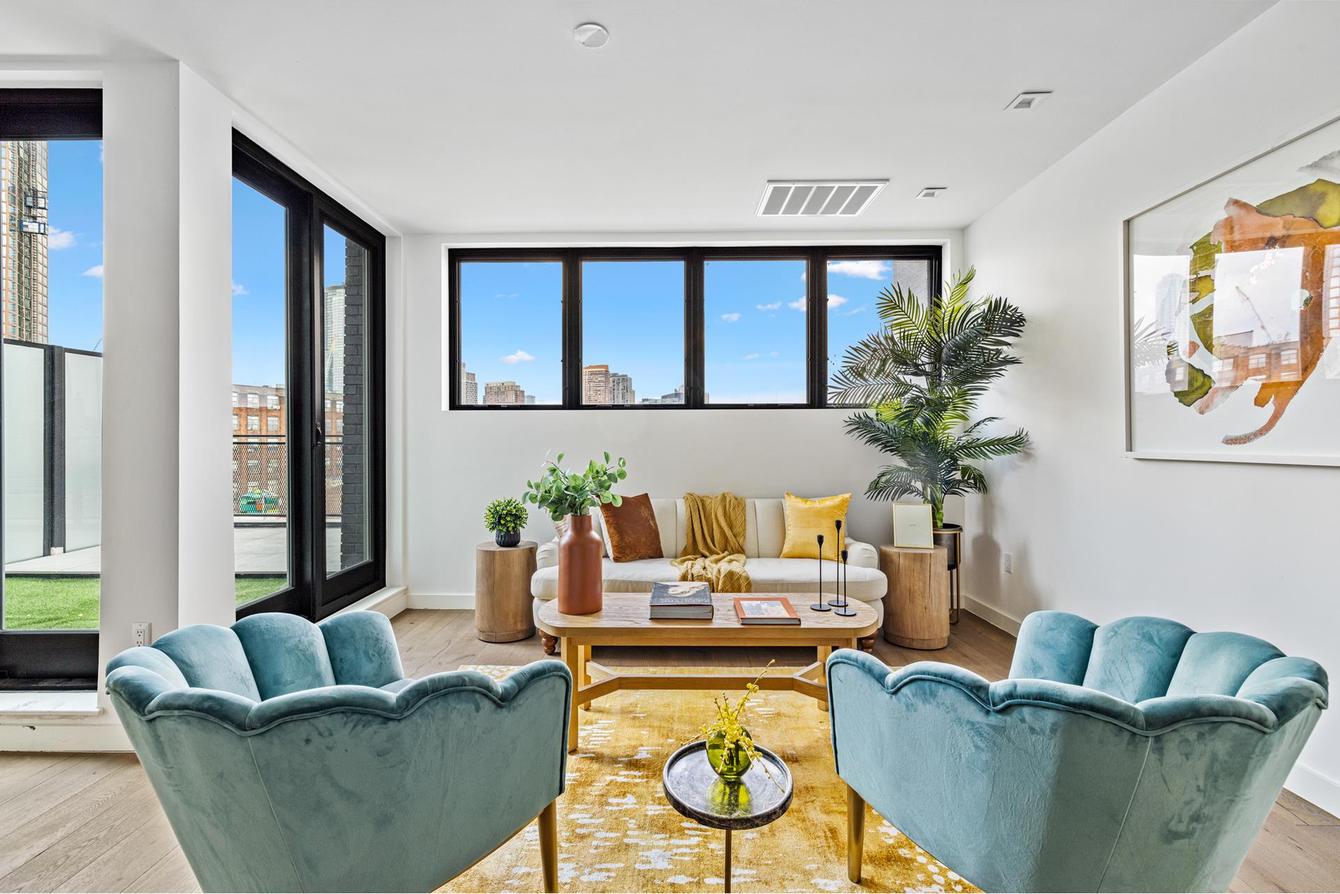 44 Box Street, Unit PHA Brooklyn, NY 11222 - Photo 3 of 18 a living room with furniture and a potted plant