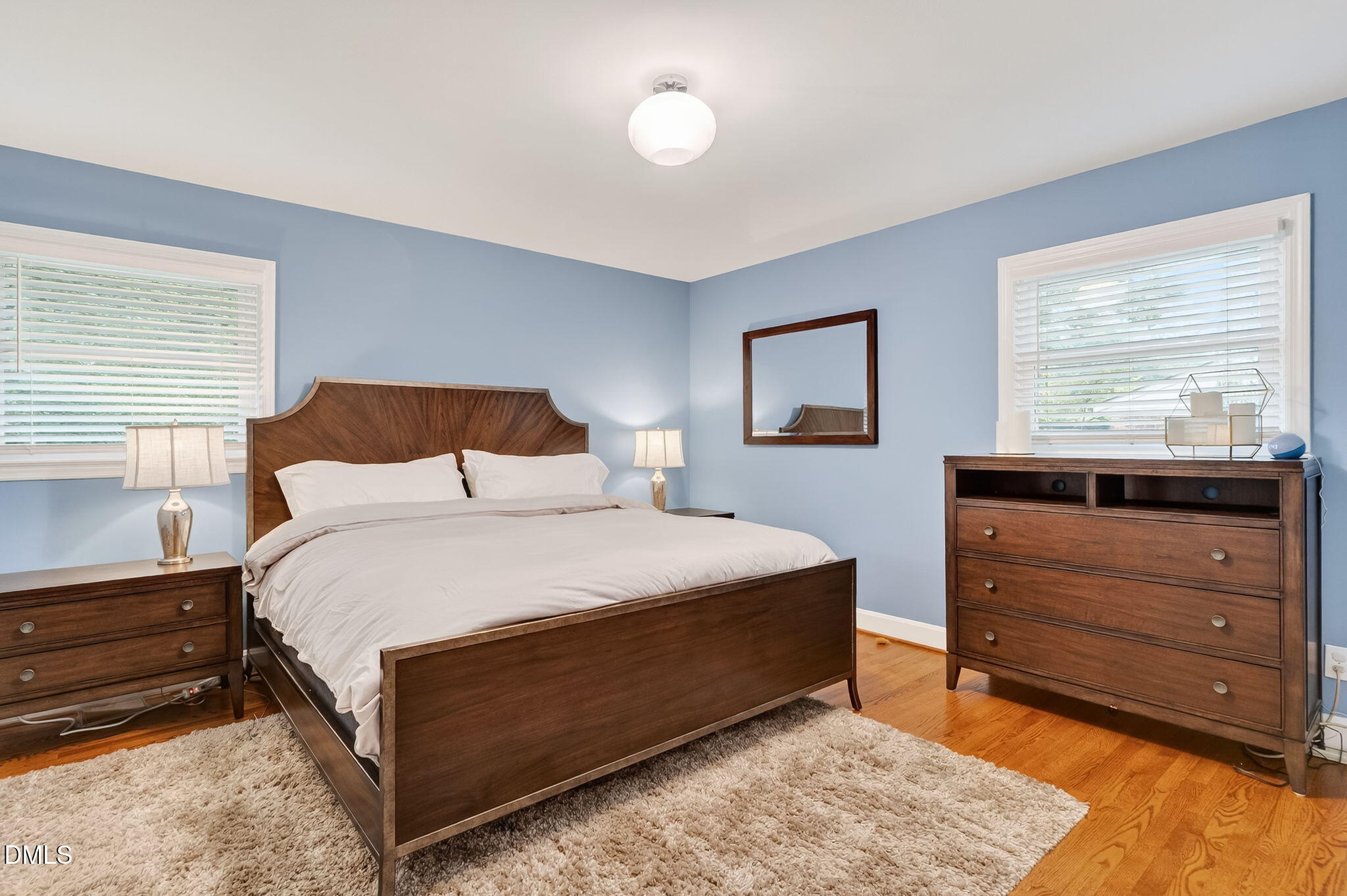 4206 Laurel Ridge Drive Raleigh, NC 27612 - Photo 20 of 62 a bedroom with a bed and a window