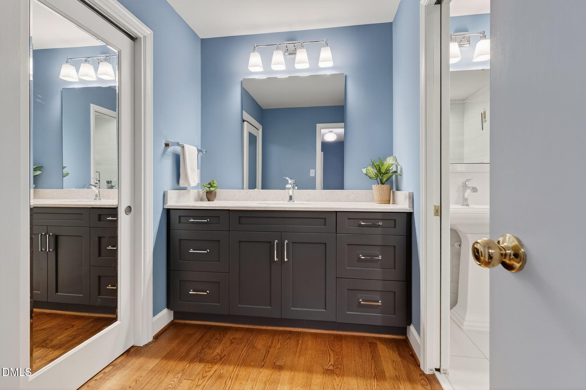 4206 Laurel Ridge Drive Raleigh, NC 27612 - Photo 24 of 62 a bathroom with a sink and a mirror