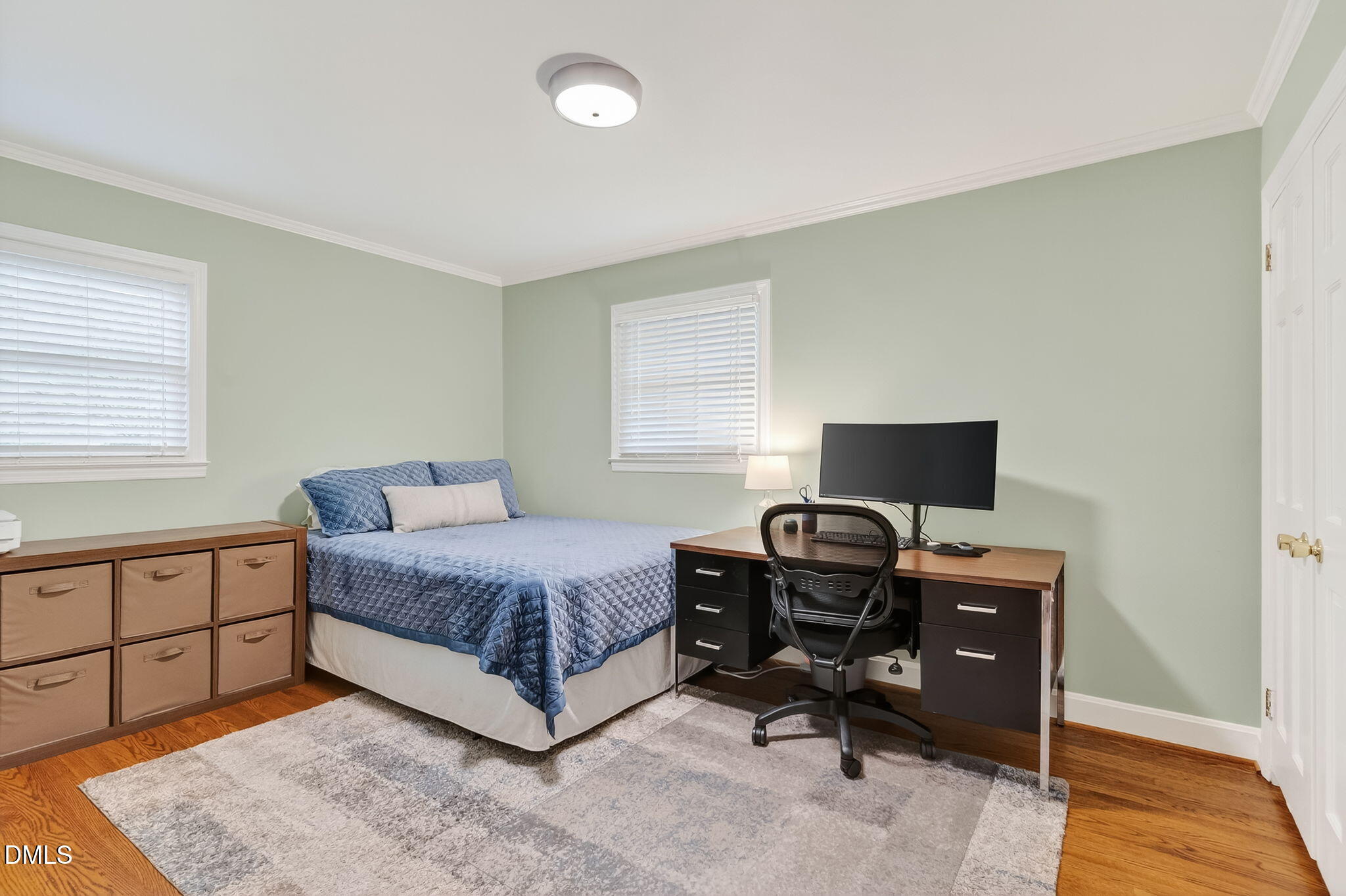 4206 Laurel Ridge Drive Raleigh, NC 27612 - Photo 29 of 62 a bedroom with a bed and a desk