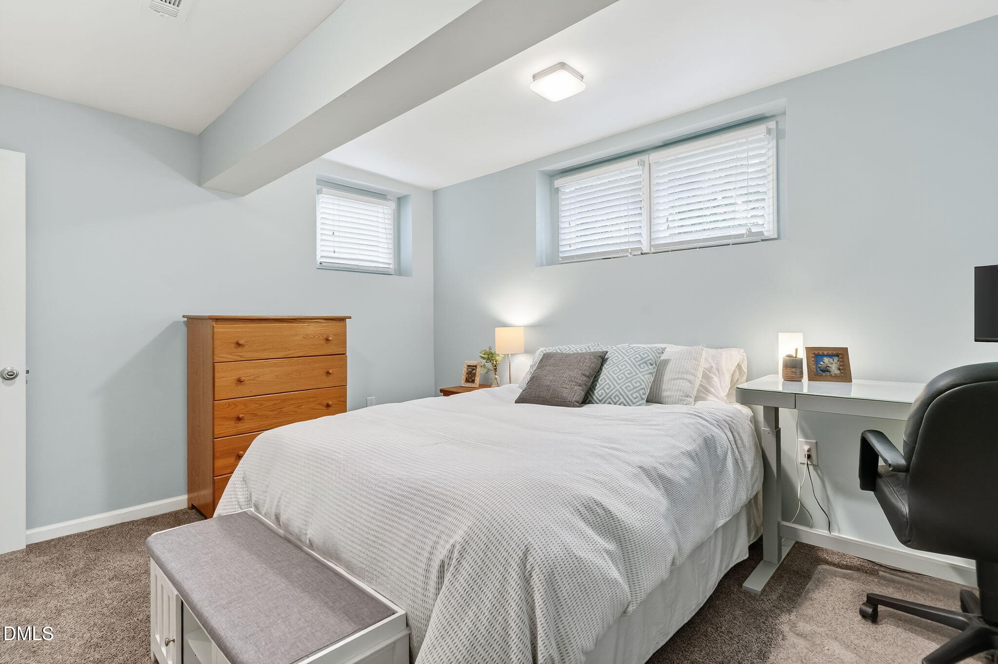 4206 Laurel Ridge Drive Raleigh, NC 27612 - Photo 32 of 62 a bedroom with a bed and wooden floor