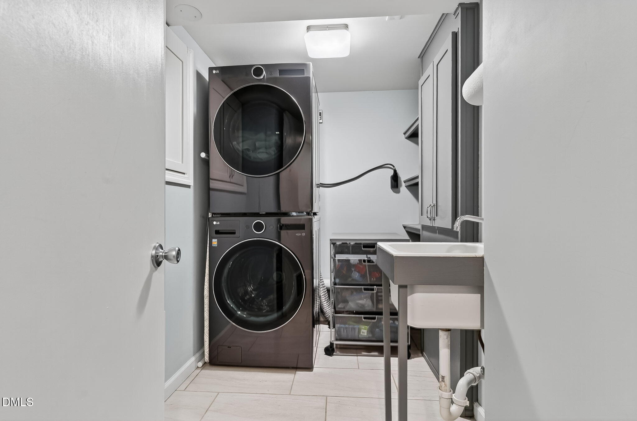 4206 Laurel Ridge Drive Raleigh, NC 27612 - Photo 38 of 62 a utility room with sink dryer and washer