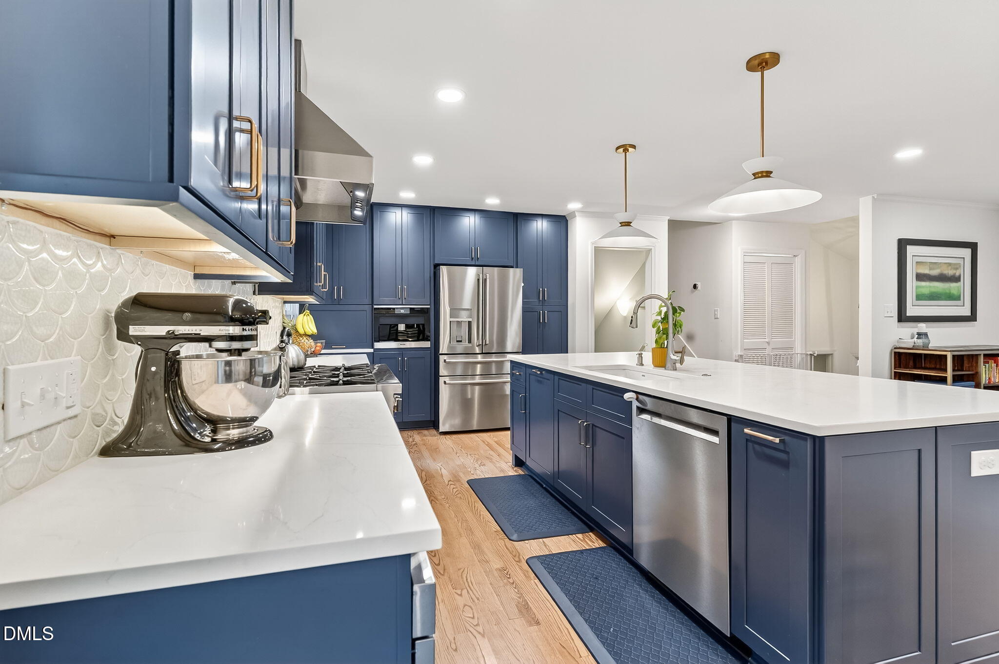 4206 Laurel Ridge Drive Raleigh, NC 27612 - Photo 3 of 62 a kitchen with kitchen island granite countertop a sink a counter top space stainless steel appliances and cabinets