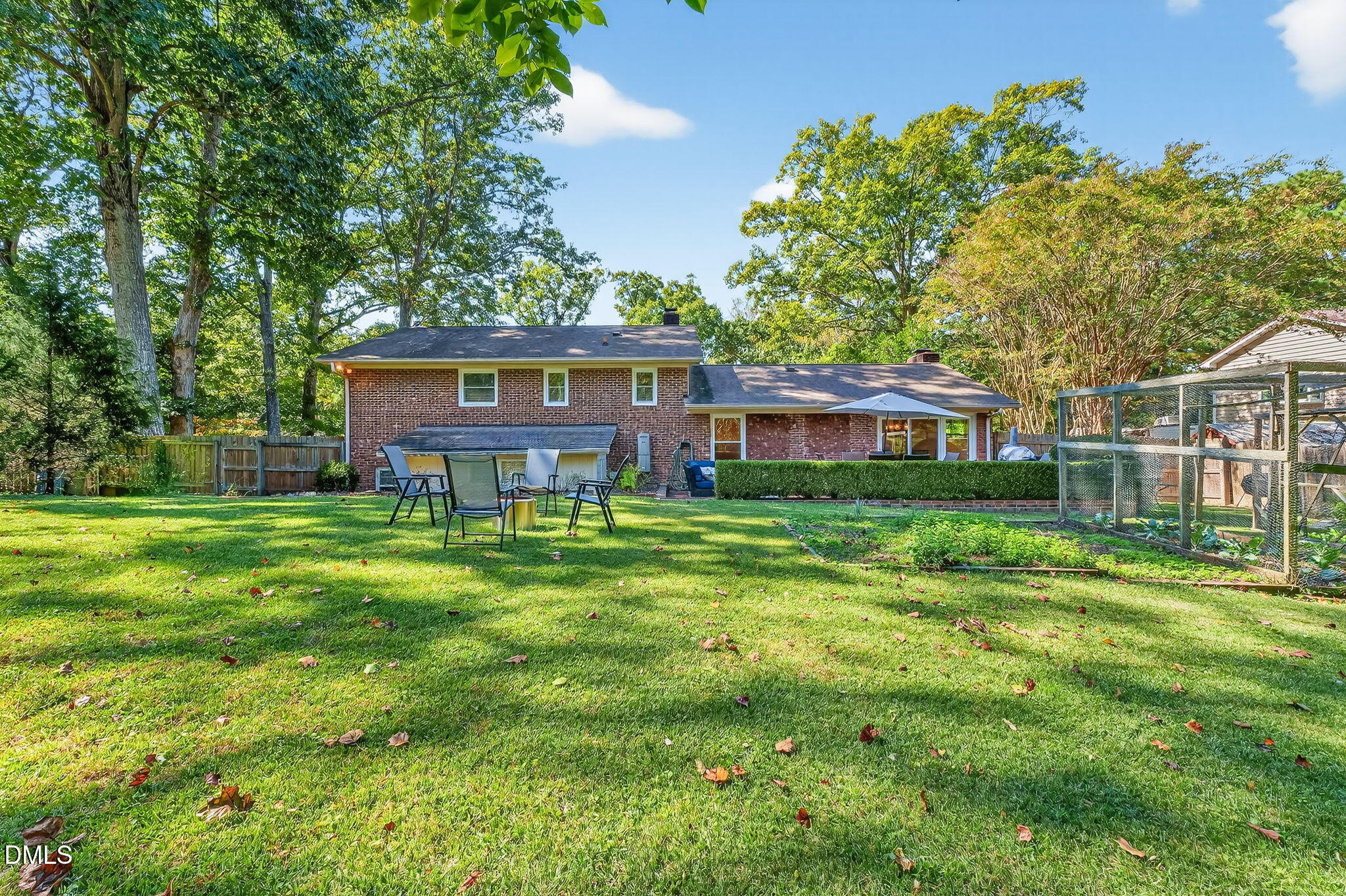 4206 Laurel Ridge Drive Raleigh, NC 27612 - Photo 46 of 62 a view of a house with a big yard and large trees