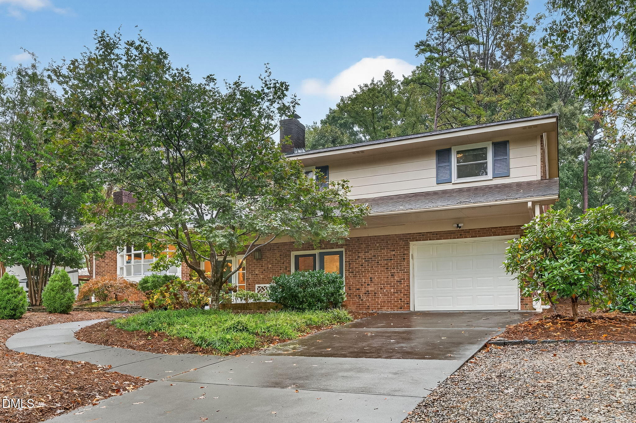 4206 Laurel Ridge Drive Raleigh, NC 27612 - Photo 4 of 62 a front view of a house with garden