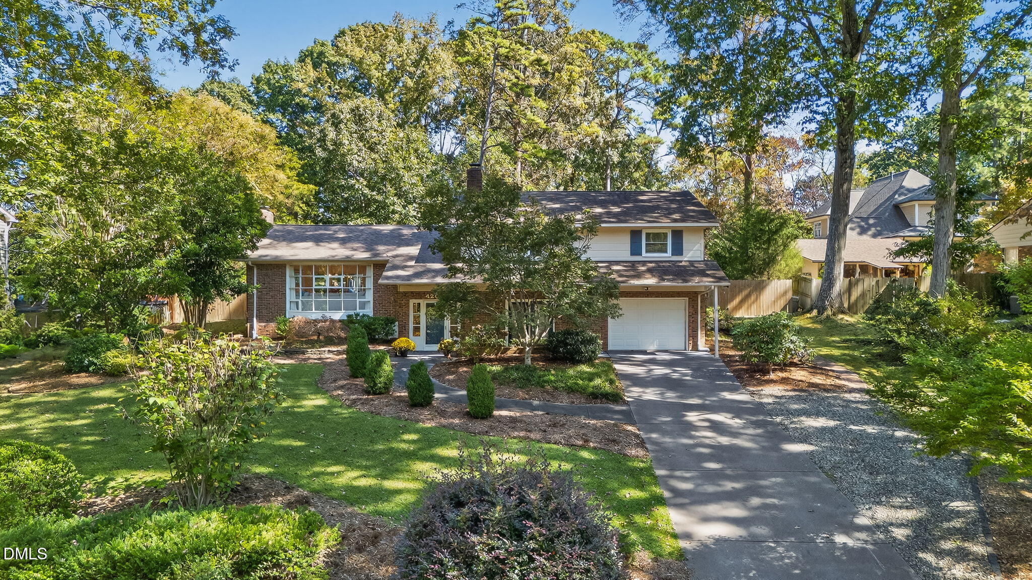 4206 Laurel Ridge Drive Raleigh, NC 27612 - Photo 56 of 62 a front view of a house with a garden
