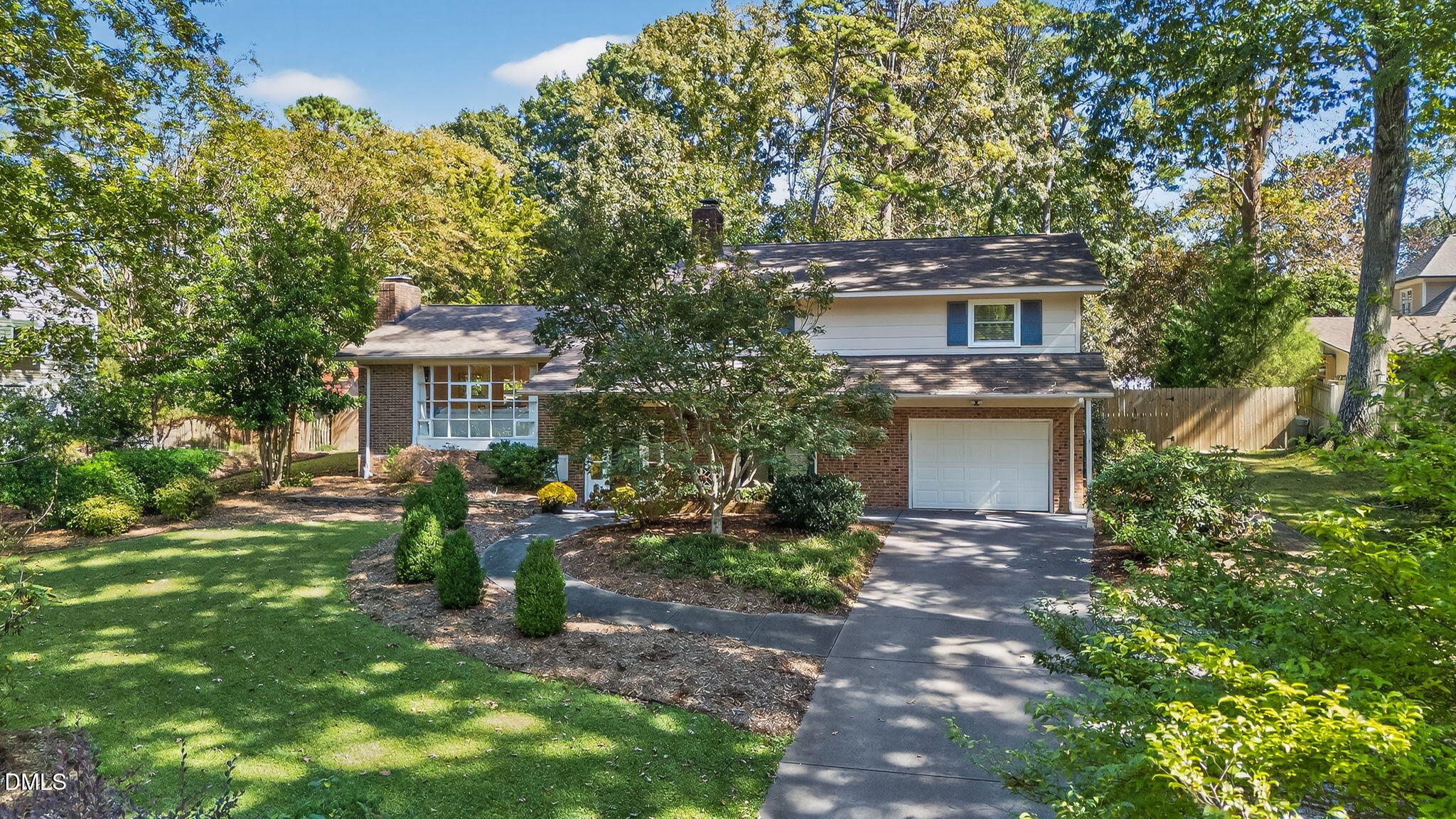 4206 Laurel Ridge Drive Raleigh, NC 27612 - Photo 57 of 62 a view of a house with backyard sitting area and garden