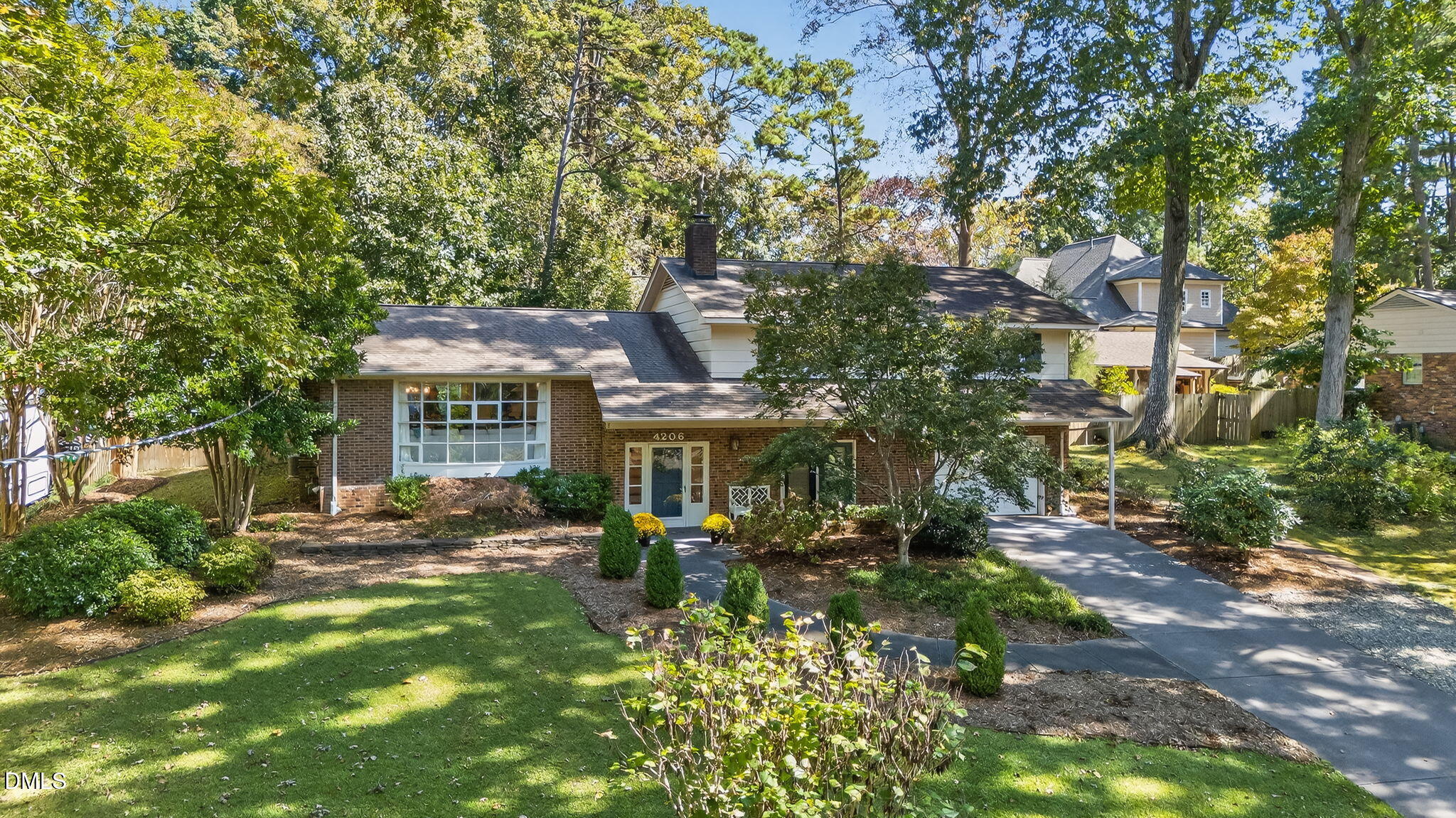4206 Laurel Ridge Drive Raleigh, NC 27612 - Photo 58 of 62 a front view of a house with a yard