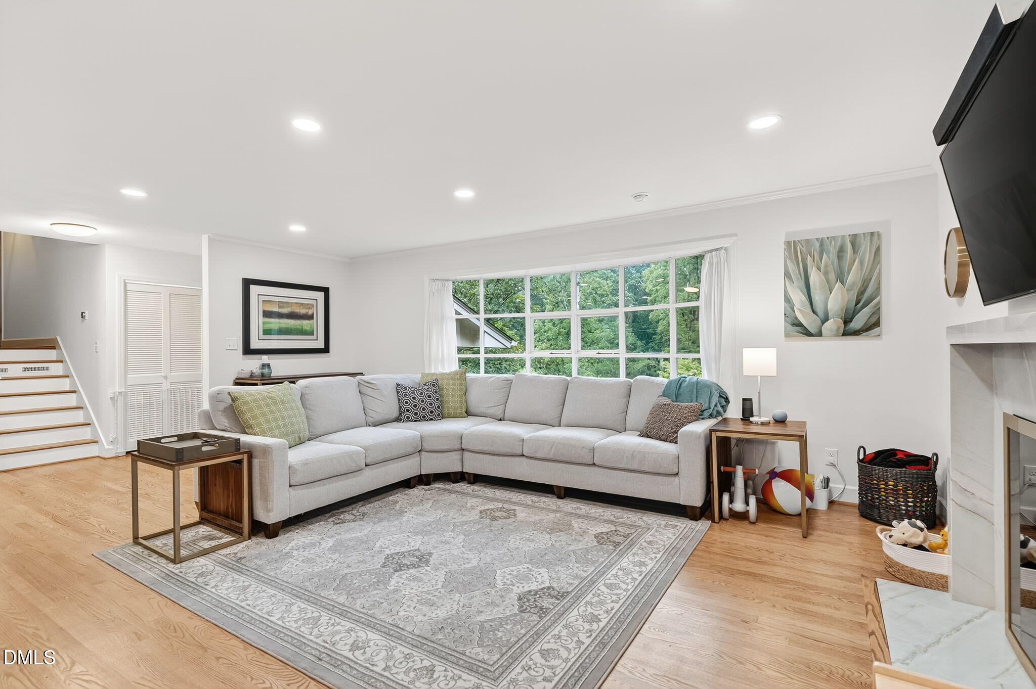 4206 Laurel Ridge Drive Raleigh, NC 27612 - Photo 8 of 62 a living room with furniture and a flat screen tv