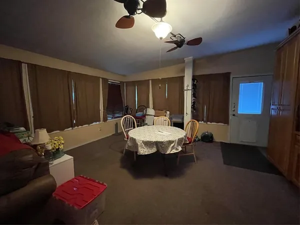 a kitchen with stainless steel appliances a stove a sink and cabinets