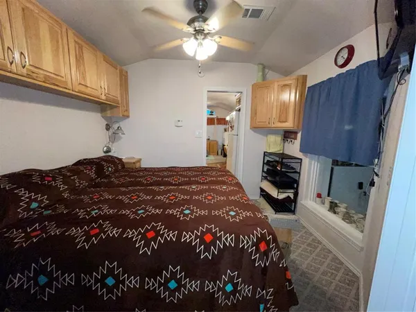 a kitchen with a stove and a refrigerator