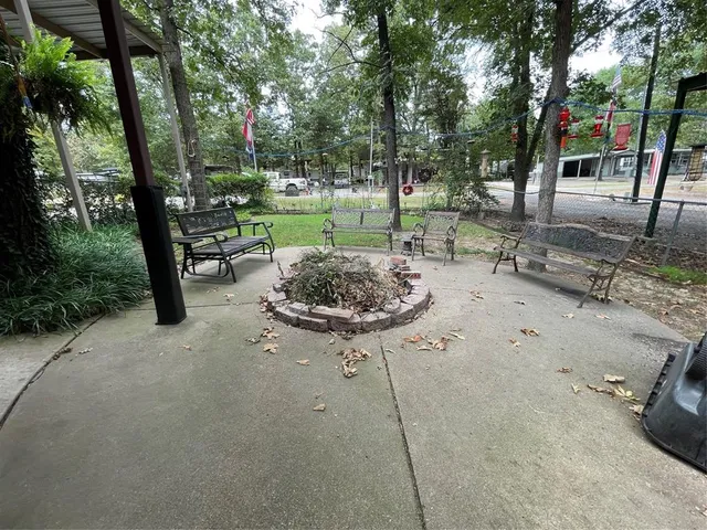 a view of a table and chairs under an umbrella