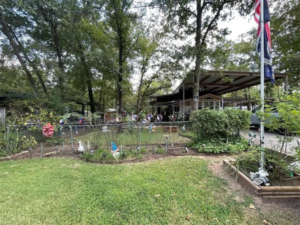 a view of a house with swimming pool and sitting area